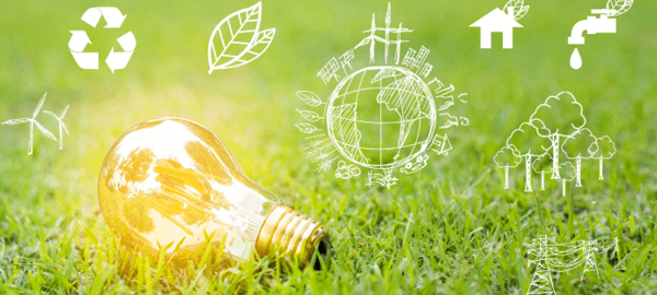 Lit light bulb powered by green and renewable energy